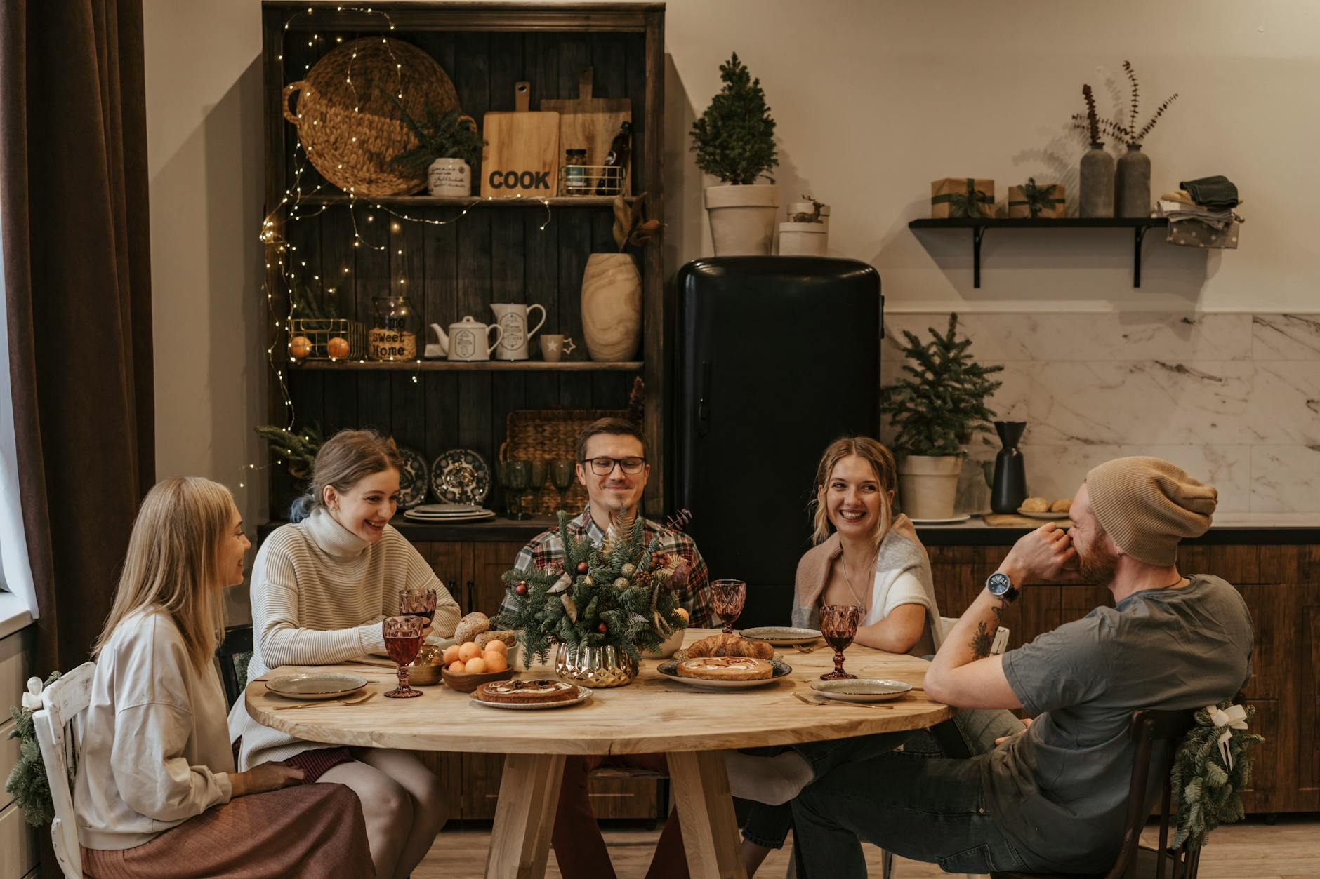 people sitting at the table enjoying conversation