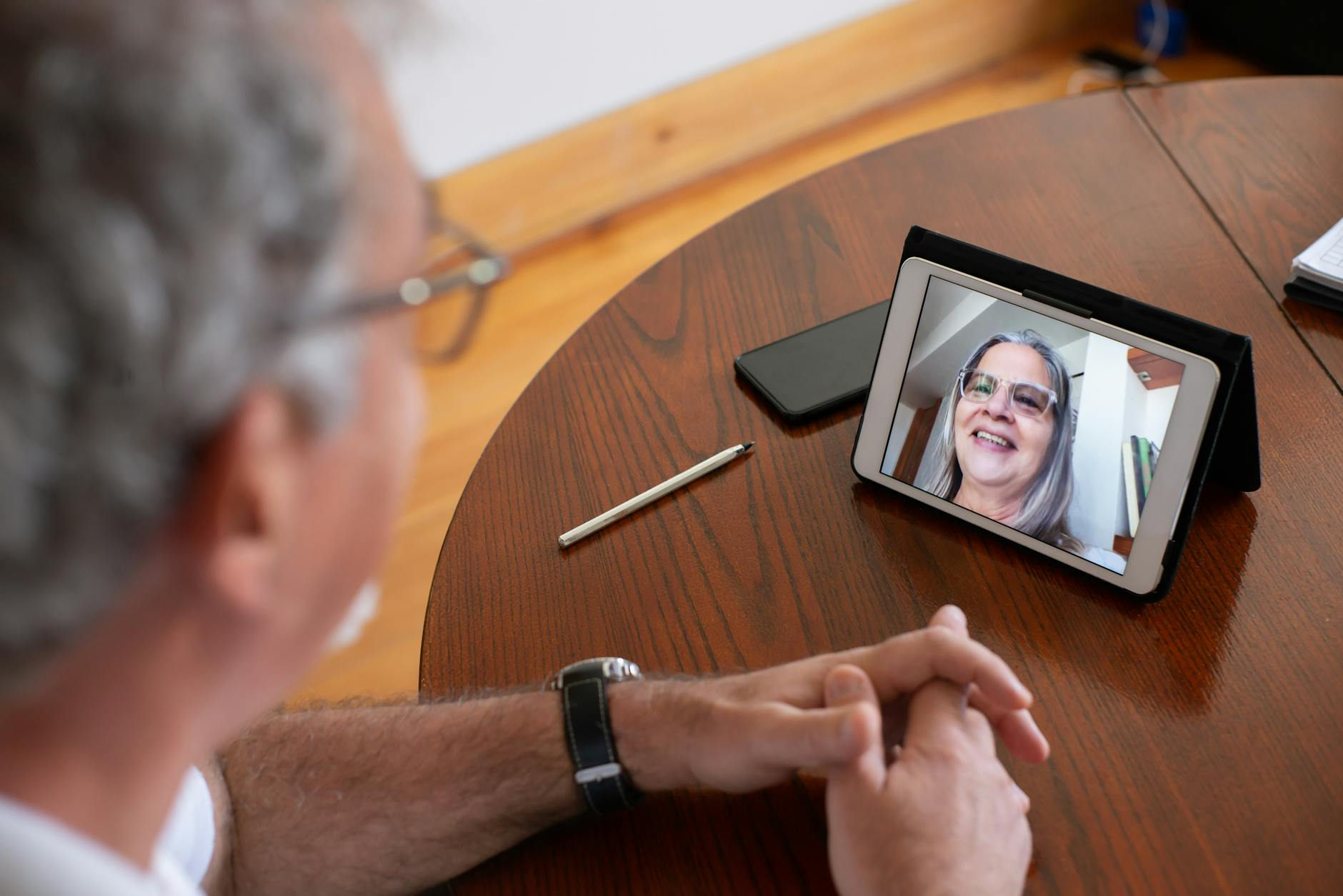 a man having video call with his wife