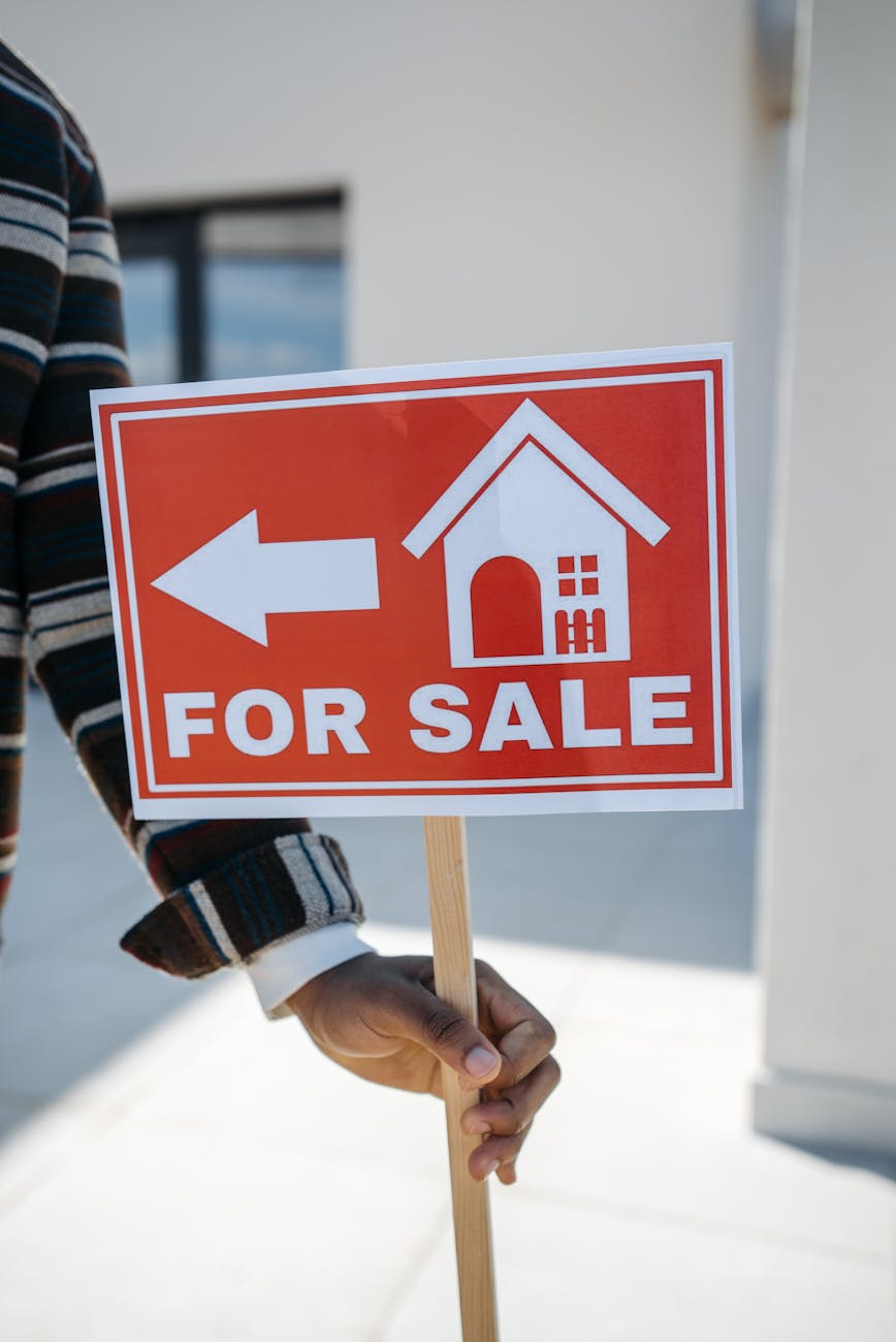 for sale direction sign in hand