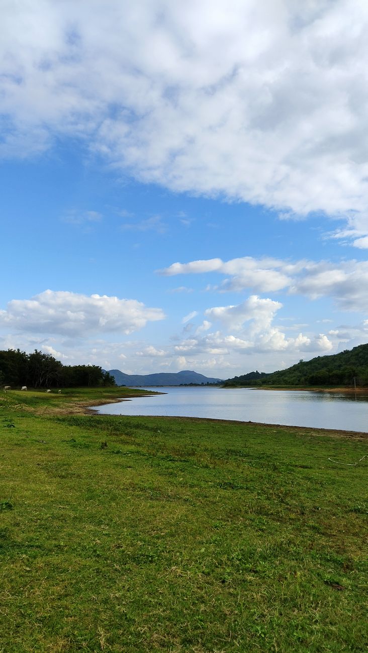 scenic landscape with blue sky and lake