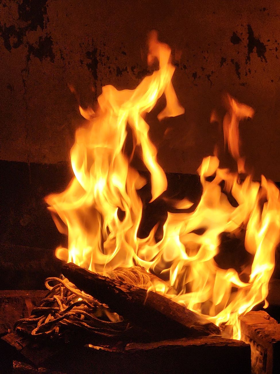 captivating flames in rustic fireplace setting