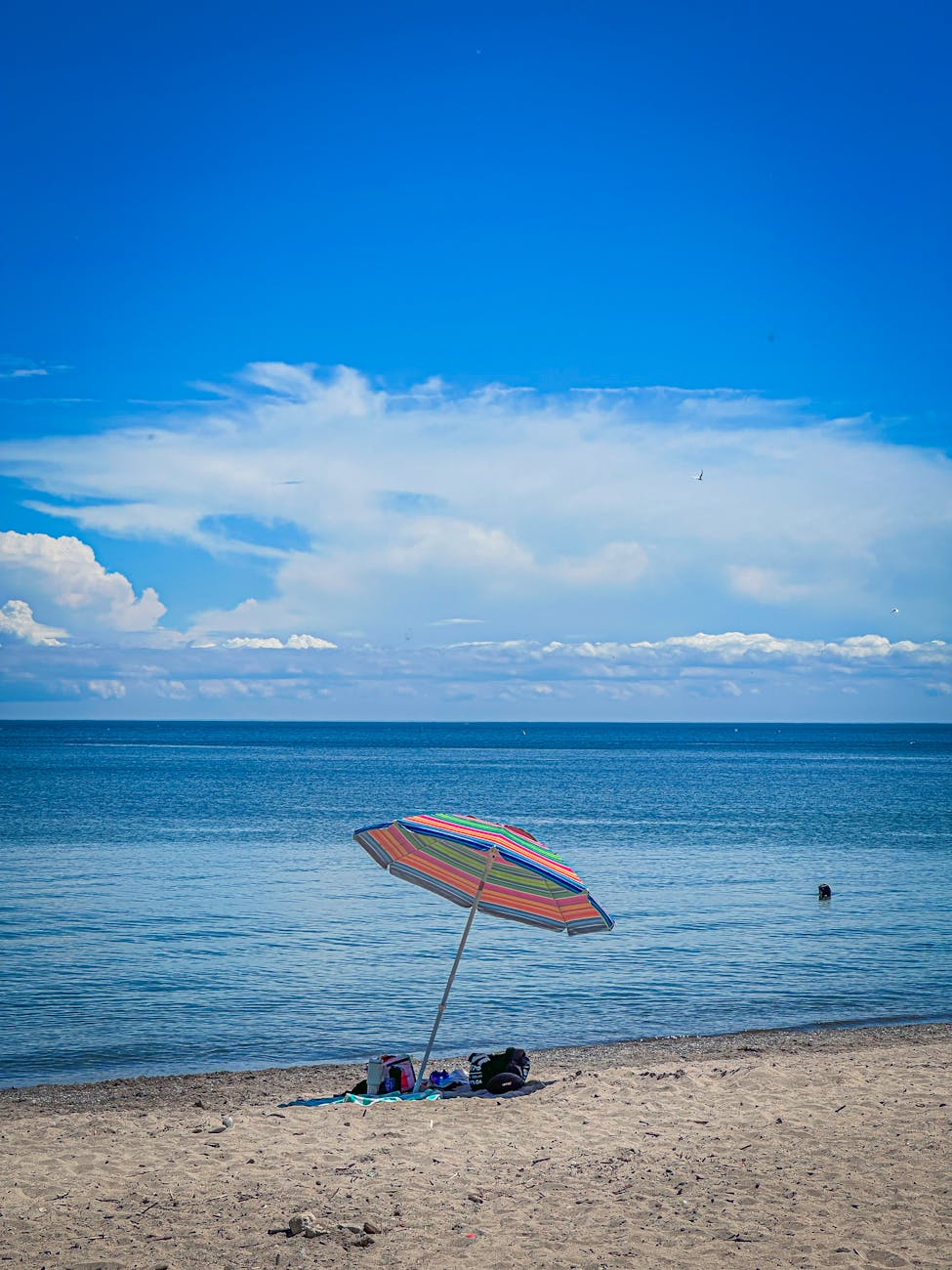 sunny beach day with colorful umbrella