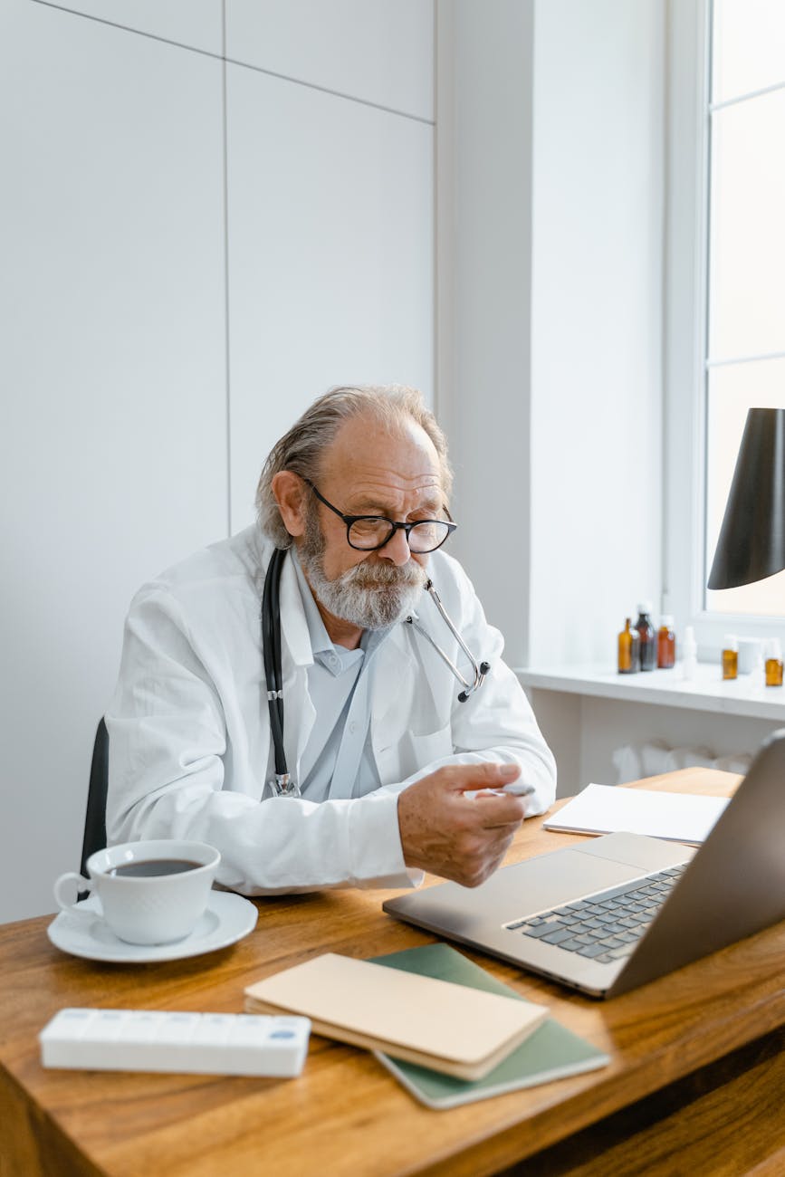a doctor in a video conference using a laptop